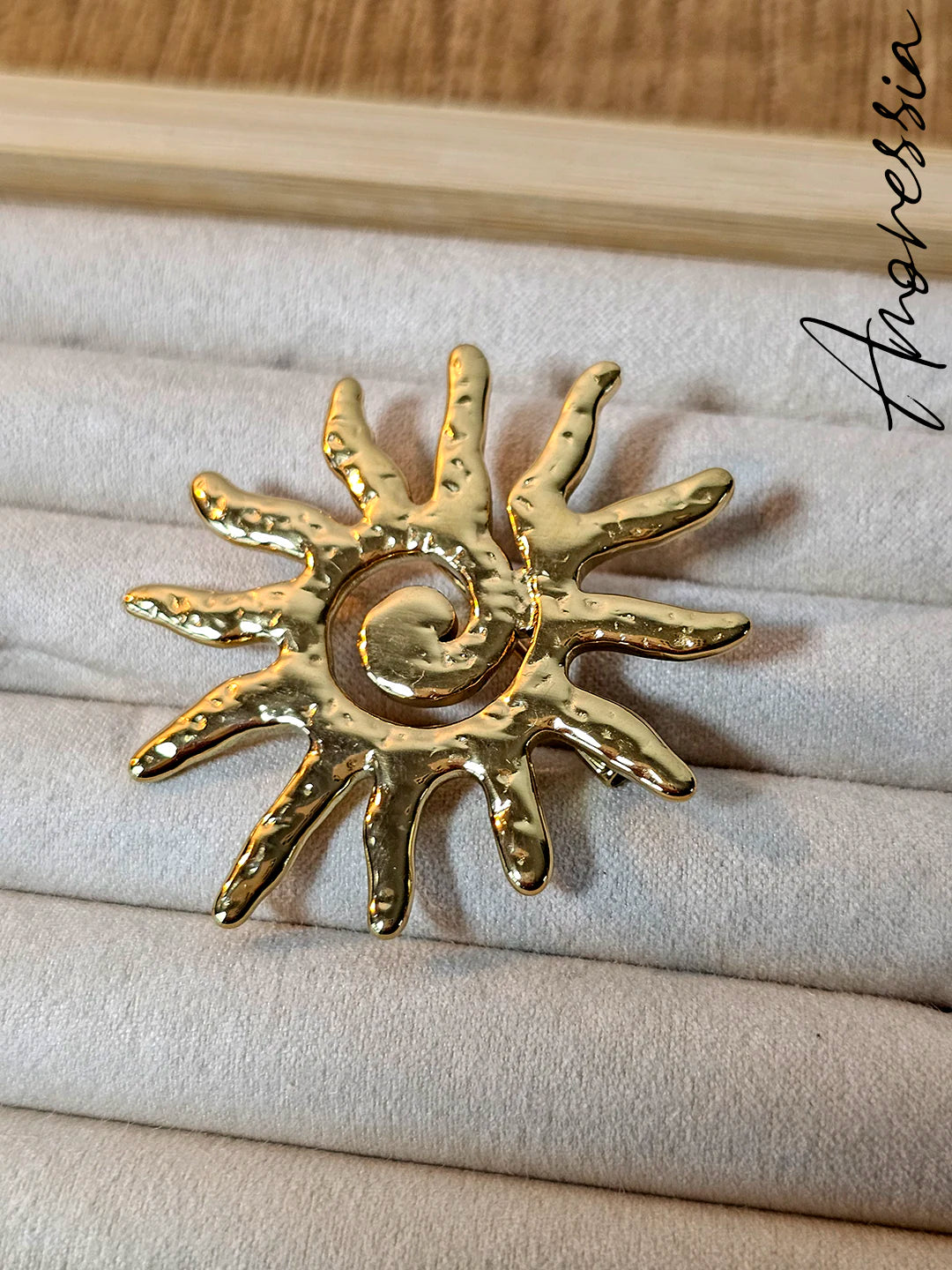 Broche soleil